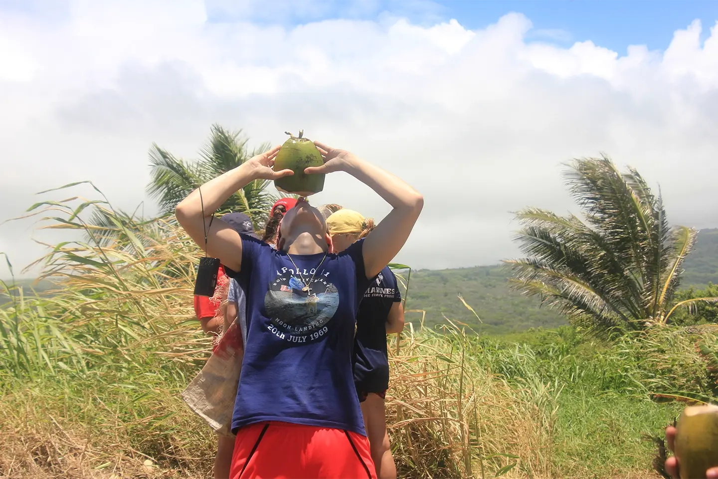 Drinking fresh coconut milk