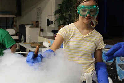 Image of camper mixing liquid nitrogen ice cream